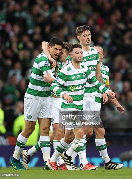 Tom Rogic of Celtic is congratulated by team mates after he scores true opening goal during the Betfred Cup Final between Aberdeen and Celtic at...
