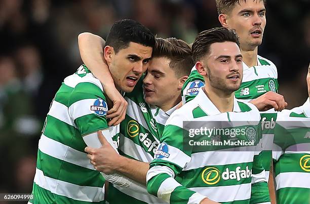 Tom Rogic of Celtic is congratulated by team mates after he scores true opening goal during the Betfred Cup Final between Aberdeen and Celtic at...