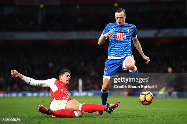 Gabriel of Arsenal tackles Brad Smith of AFC Bournemouth during the Premier League match between Arsenal and AFC Bournemouth at Emirates Stadium on...