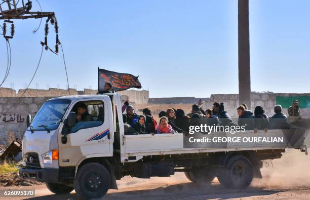 Syrian displaced families arrive at a makeshift camp on November 27, 2016 in the government-held district of Jibreen in Aleppo, as civilians have...