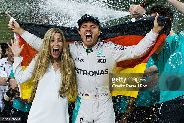Nico Rosberg of Germany and Mercedes celebrates winning the F1 Drivers Championship with his Wife Vivian Sibold at the Abu Dhabi Formula One Grand...
