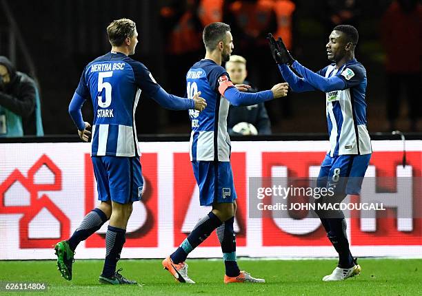 Berlin's Bosnian forward Vedad Ibisevic celebrates with Berlin's Ivorian forward Salomon Armand Kalou and Berlin's defender Niklas Stark after...