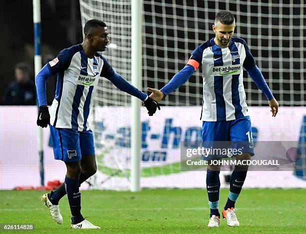 Berlin's Bosnian forward Vedad Ibisevic celebrates with Berlin's Ivorian forward Salomon Armand Kalou after scoring the 1-1 goal during the German...