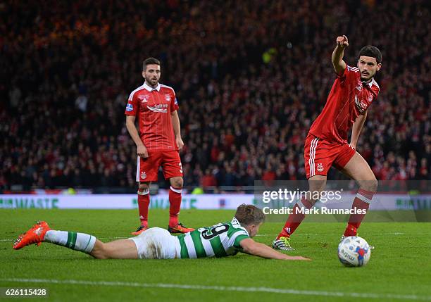 James Forrest of Celtic is challenged in the penalty box by Anthony O'Conner of Aberdeen resting in a penalty to Celtic during the Betfred Cup Final...