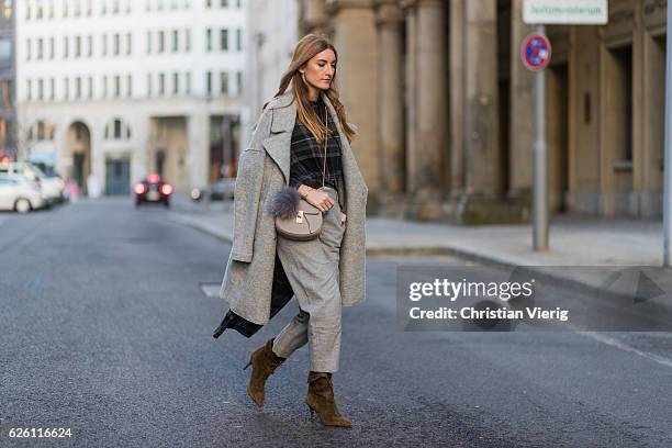 Sofia Grau wearing a grey Tommy Hilfiger wool coat, a black plaid Zara top, grey cropped pants COS, Chloe bag, khaki heeled ankle boots shoes...