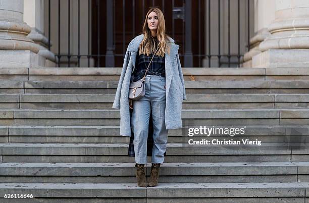 Sofia Grau wearing a grey Tommy Hilfiger wool coat, a black plaid Zara top, grey cropped pants COS, Chloe bag, khaki heeled ankle boots shoes...