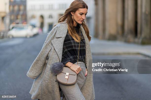 Sofia Grau wearing a grey Tommy Hilfiger wool coat, a black plaid Zara top, grey cropped pants COS, Chloe bag, on November 27, 2016 in Berlin,...