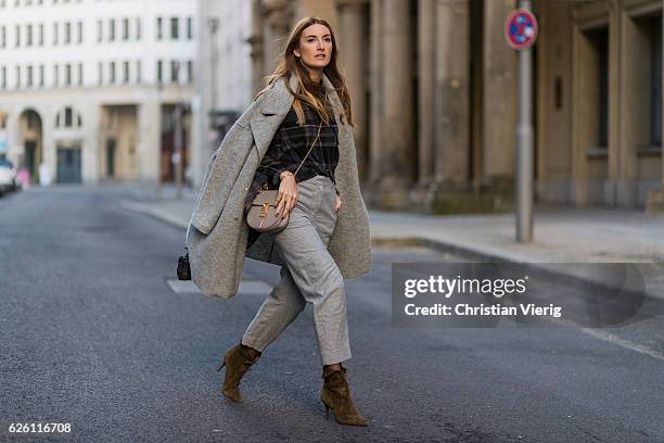 Sofia Grau wearing a grey Tommy Hilfiger wool coat, a black plaid Zara top, grey cropped pants COS, Chloe bag, khaki heeled ankle boots shoes...