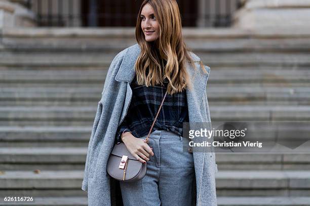 Sofia Grau wearing a grey Tommy Hilfiger wool coat, a black plaid Zara top, grey cropped pants COS, Chloe bag, on November 27, 2016 in Berlin,...
