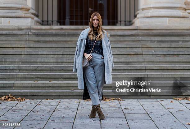 Sofia Grau wearing a grey Tommy Hilfiger wool coat, a black plaid Zara top, grey cropped pants COS, Chloe bag, khaki heeled ankle boots shoes...