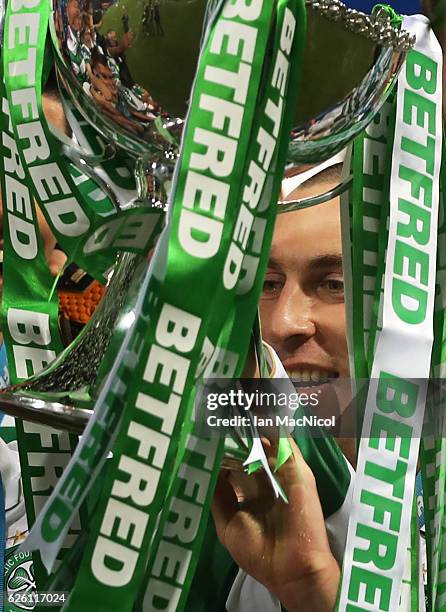 Leigh Griffiths and Scott Brown of Celtic lift the trophy during the Betfred Cup Final between Aberdeen and Celtic at Hampden Park on November 27,...