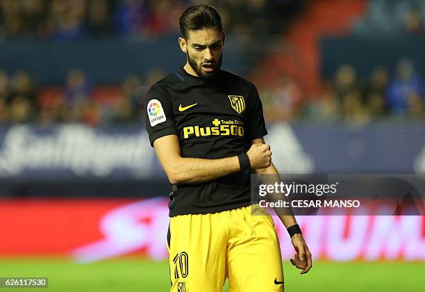 Atletico Madrid's Belgian midfielder Yannick Ferreira Carrasco celebrates after scoring during the Spanish league football match CA Osasuna vs Club...