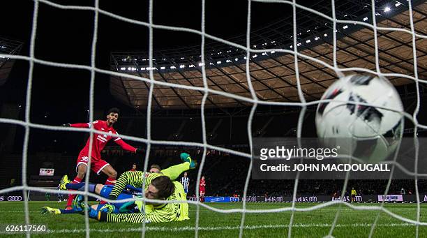 Mainz' forward Aaron seydel scores the opening goal past Berlin's Norwegian goalkeeper Rune Almenning Jarstein during the German first division...