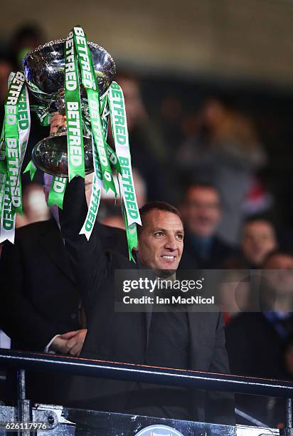 Celtic manager Brendan Rogers lifts the trophy during the Betfred Cup Final between Aberdeen and Celtic at Hampden Park on November 27, 2016 in...