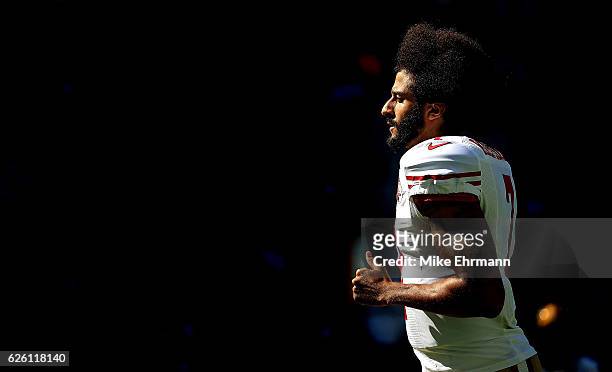 Colin Kaepernick of the San Francisco 49ers warms up during a game against the Miami Dolphins on November 27, 2016 in Miami Gardens, Florida.