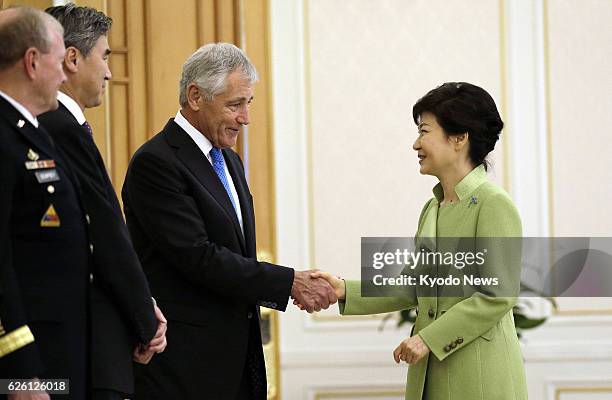 South Korea - U.S. Defense Secretary Chuck Hagel and South Korean President Park Geun Hye shake hands before their meeting in Seoul on Sept. 30, 2013.