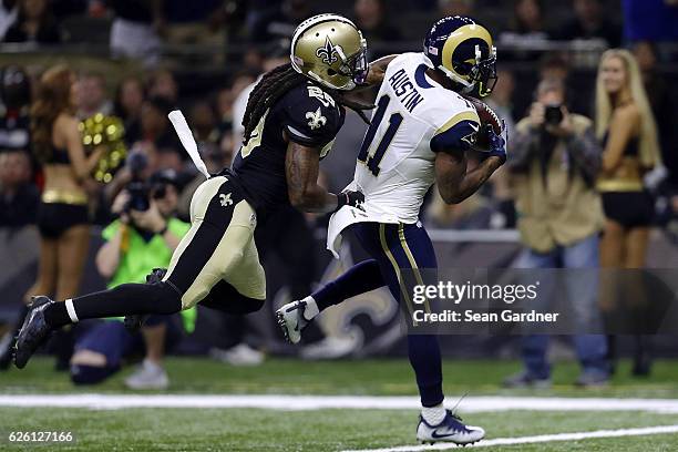 Tavon Austin of the Los Angeles Rams catches a pass for a touchdown over B.W. Webb of the New Orleans Saints during the first half of a game at the...