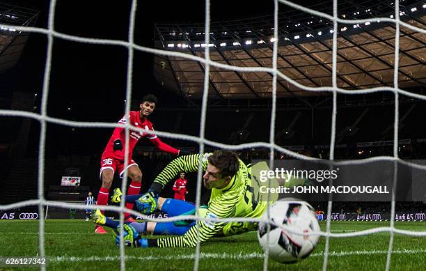 Mainz' forward Aaron seydel scores the opening goal past Berlin's Norwegian goalkeeper Rune Almenning Jarstein during the German first division...