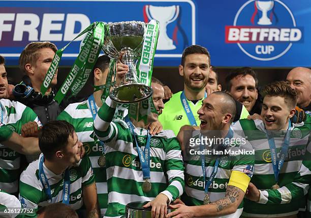 Leigh Griffiths of Celtic lifts the trophy during the Betfred Cup Final between Aberdeen and Celtic at Hampden Park on November 27, 2016 in Glasgow,...