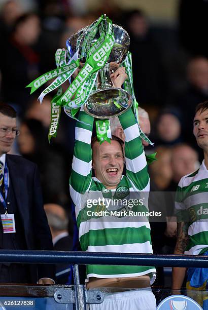 Leigh Griffiths lifts the trophy as Celtic win the Betfred Cup Final between Aberdeen FC and Celtic FC at Hampden Park on November 27, 2016 in...