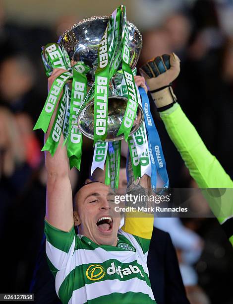 Celtic captain Scott Brown lifts the trophy as Celtic win the Betfred Cup Final between Aberdeen FC and Celtic FC at Hampden Park on November 27,...