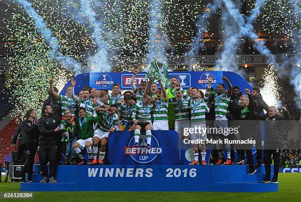 The Celtic team pose after winning the Betfred Cup Final between Aberdeen FC and Celtic FC at Hampden Park on November 27, 2016 in Glasgow, Scotland.