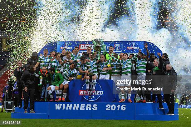 The Celtic team pose after winning the Betfred Cup Final between Aberdeen FC and Celtic FC at Hampden Park on November 27, 2016 in Glasgow, Scotland.