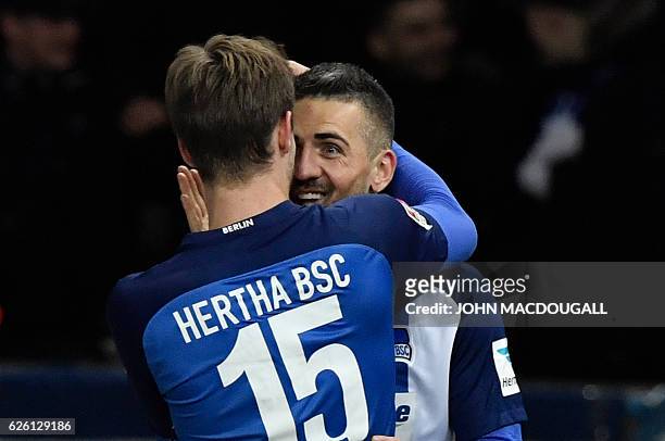 Berlin's Bosnian forward Vedad Ibisevic celebrates with Berlin's defender Sebastian Langkamp after he scored his second goal during the German first...