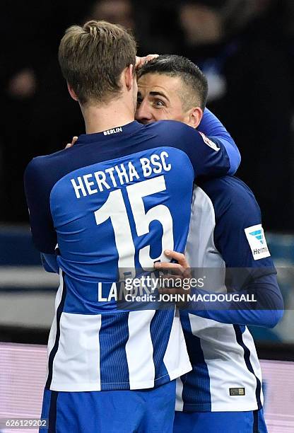 Berlin's Bosnian forward Vedad Ibisevic celebrates with Berlin's defender Sebastian Langkamp after he scored his second goal during the German first...