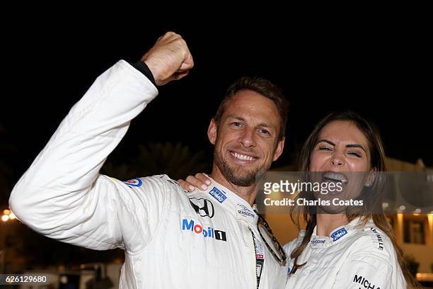 Jenson Button of Great Britain and McLaren Honda with girlfriend Brittny Ward leaving the paddock together after Jenson's final F1 race during the...