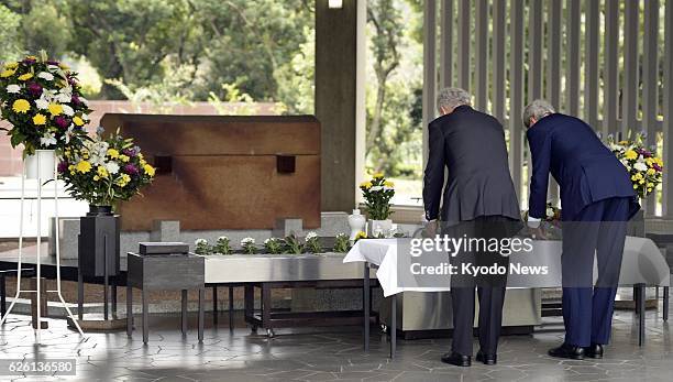 Japan - U.S. Secretary of State John Kerry and Defense Secretary Chuck Hagel offer flowers at the Chidorigafuchi National Cemetery in Tokyo on Oct....