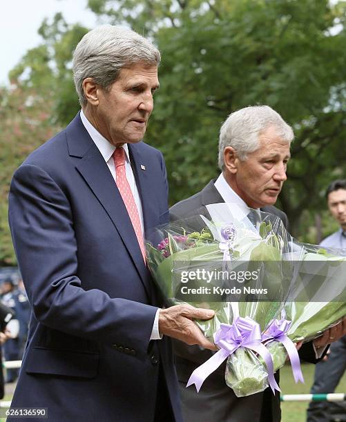 Japan - U.S. Secretary of State John Kerry and Defense Secretary Chuck Hagel offer flowers at the Chidorigafuchi National Cemetery in Tokyo on Oct....