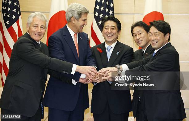 Japan - U.S. Defense Secretary Chuck Hagel, U.S. Secretary of State John Kerry, Japanese Prime Minister Shinzo Abe, Japanese Foreign Minister Fumio...