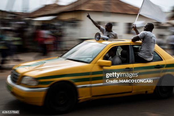 Supporters of Adama Barrow, the flag-bearer of the coalition of the seven opposition political parties in Gambia parade through the streets of Banjul...