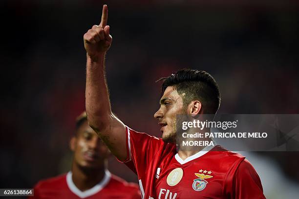 Benfica's Mexican forward Raul Jimenez celebrates after scoring during the Portuguese league football match SL Benfica vs Moreirense FC at the Luz...