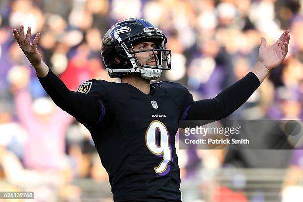 Kicker Justin Tucker of the Baltimore Ravens celebrates after kicking a field goal in the second quarter against the Cincinnati Bengals at M&T Bank...