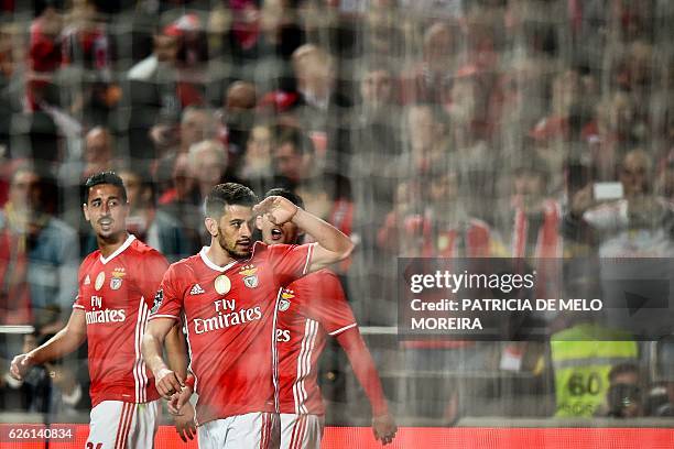 Benfica's midfielder Pizzi Fernandes celebrates after scoring during the Portuguese league football match SL Benfica vs Moreirense FC at the Luz...