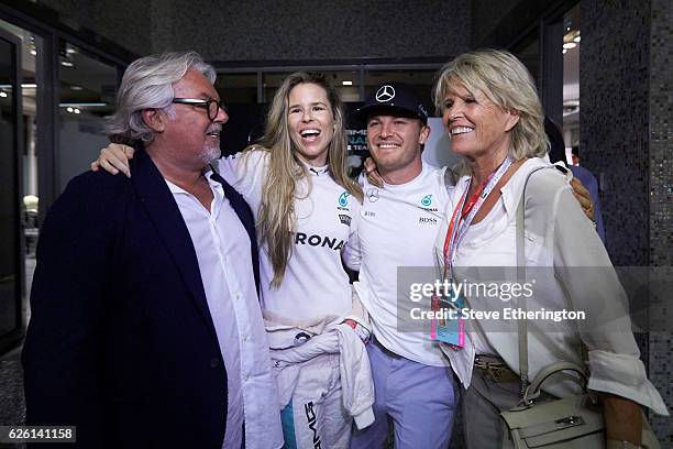 World Drivers Champion Nico Rosberg of Germany and Mercedes GP with father and former F1 Champion Keke Rosberg, his wife, Vivian Sibold and mother...