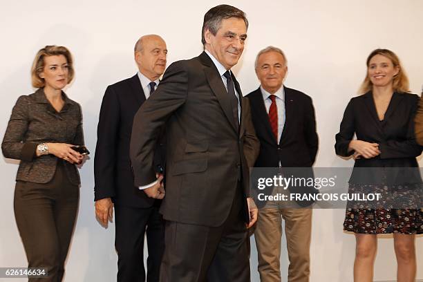 Winner of the right-wing primaries ahead of France's 2017 presidential elections, Francois Fillon , flanked by defeated candidate Alain Juppe and...