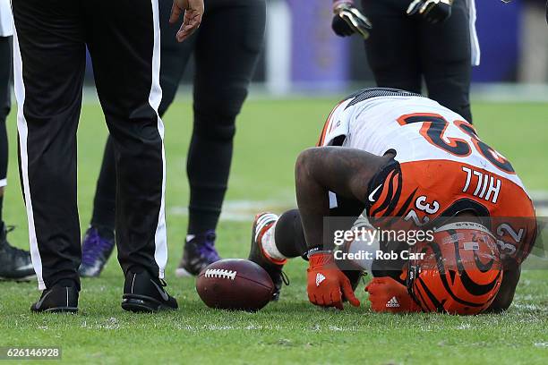 Running back Jeremy Hill of the Cincinnati Bengals lays injured on the field against the Baltimore Ravens in the second quarter at M&T Bank Stadium...