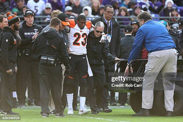 Defensive back Chykie Brown of the Cincinnati Bengals is helped off of the field after being injured in the second quarter against the Baltimore...