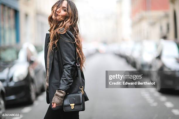 Sofya Benzakour , is wearing a Tobi pull over, River Island black pants, River Island boots, a Reiko blue jacket, and a Monki bag, on November 27,...