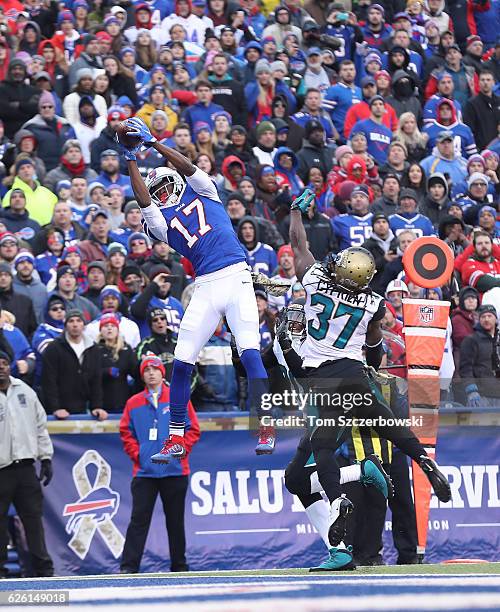 Justin Hunter of the Buffalo Bills catches a touchdown in the end zone in the fourth quarter during NFL game action as Johnathan Cyprien of the...