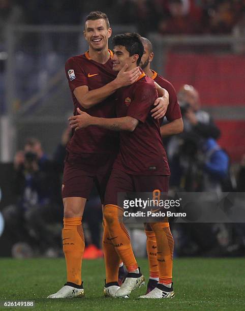 Diego Perotti with Edin Dzeko of AS Roma celebrates after scoring the team's third goal from penalty spot during the Serie A match between AS Roma...