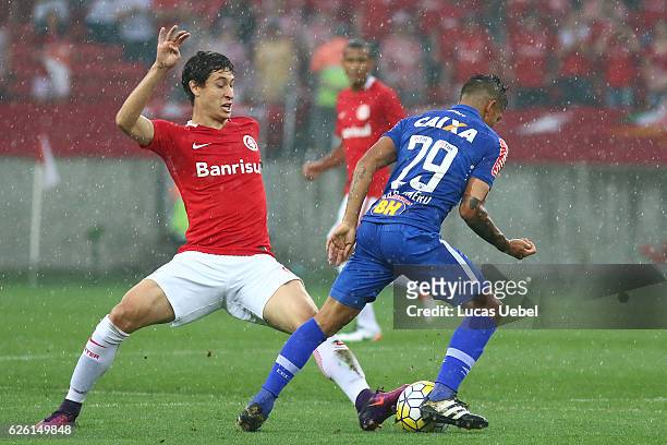 Rodrigo Dourado of Internacional battles for the ball against Lucas Romero of Cruzeiro during the match between Internacional and Cruzeiro as part of...
