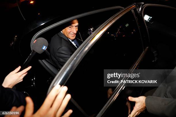 Winner of the right-wing primaries ahead of France's 2017 presidential elections, Francois Fillon enters a car as he leaves after delivering a speech...