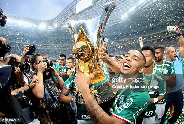 Gabriel Jesus of Palmeiras celebrates with the trophy after winning the match between Palmeiras and Chapecoense for the Brazilian Series A 2016 at...