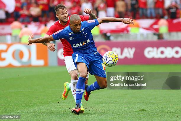 Nico Lopez of Internacional battles for the ball against Edimar of Cruzeiro during the match between Internacional and Cruzeiro as part of...