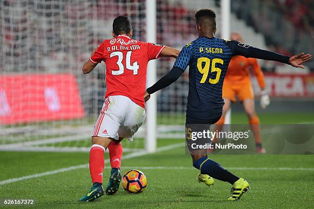 Benficas defender Andre Almeida from Portugal with Moreirenses defender Pierre Sagna during Premier League 2016/17 match between SL Benfica and...