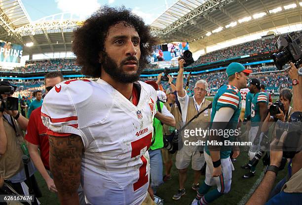 Colin Kaepernick of the San Francisco 49ers looks on during a game against the Miami Dolphins on November 27, 2016 in Miami Gardens, Florida.